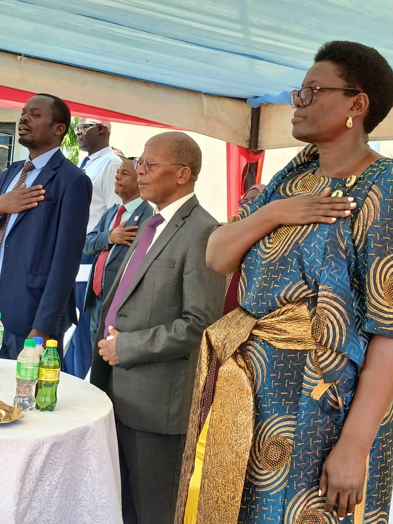 Guests stand for the national anthem