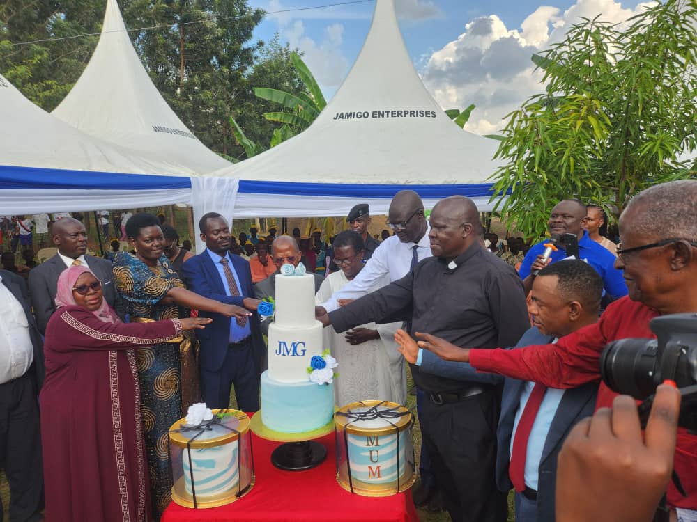 Guests join in cutting the commissioning cake